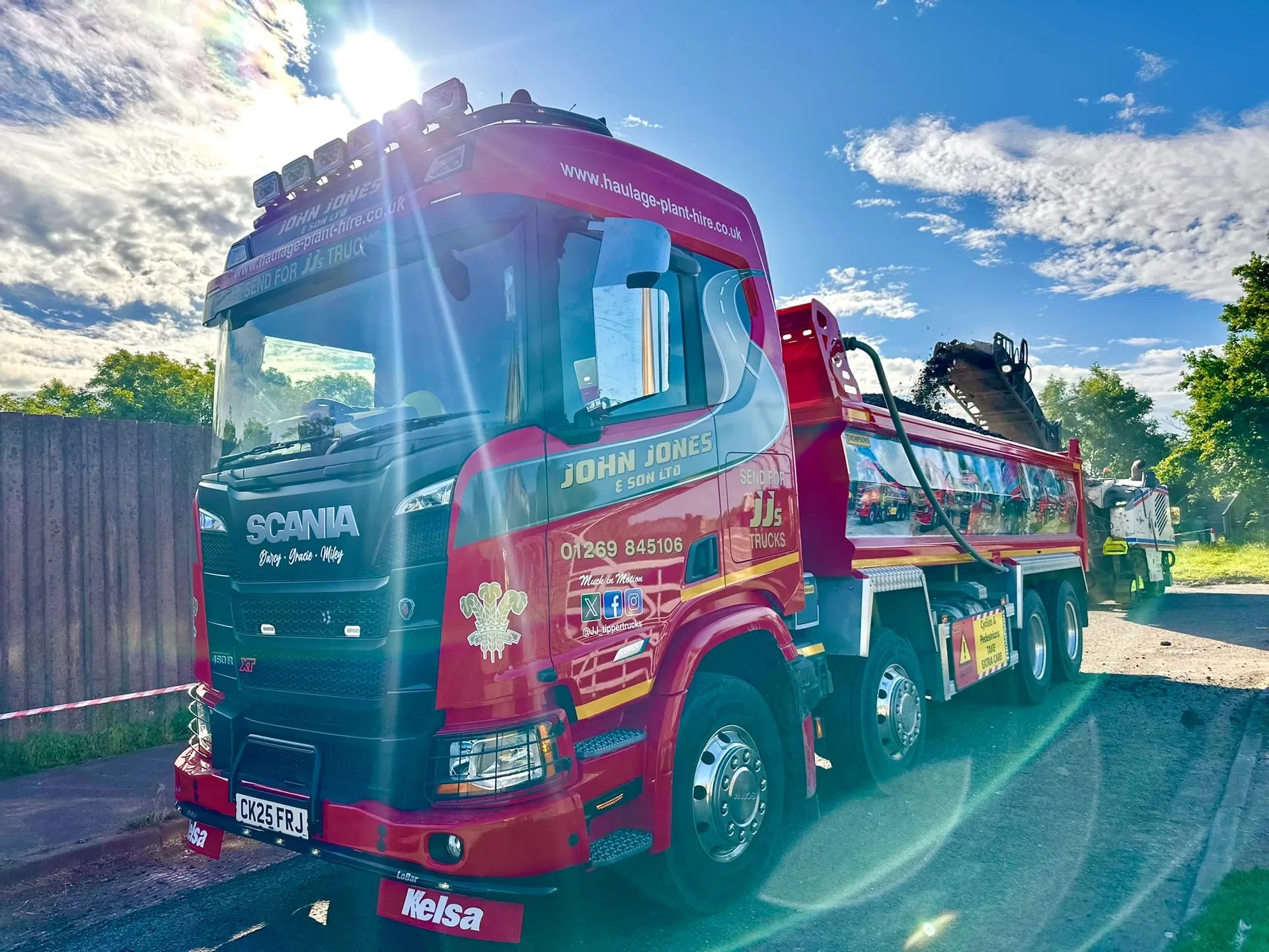 Modern 8 wheel tipper lorry on site